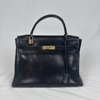 HERMES, Sac "Kelly" retourné 32 cm en veau box noir Chiffré MM. Circa 1965