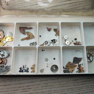 Box With used Watch parts probably for ut 6325, ut 6425 or ut 6376