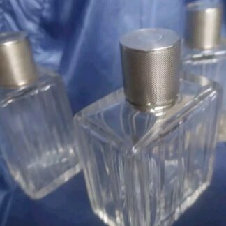 Trois flacons de parfum cristal et argent massif minerve Art Deco
